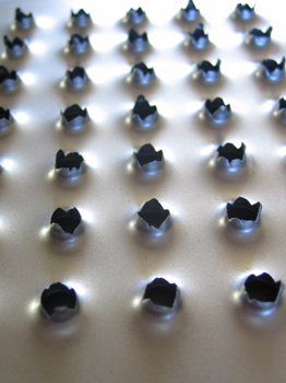 sculpture steel plate with grid of holes